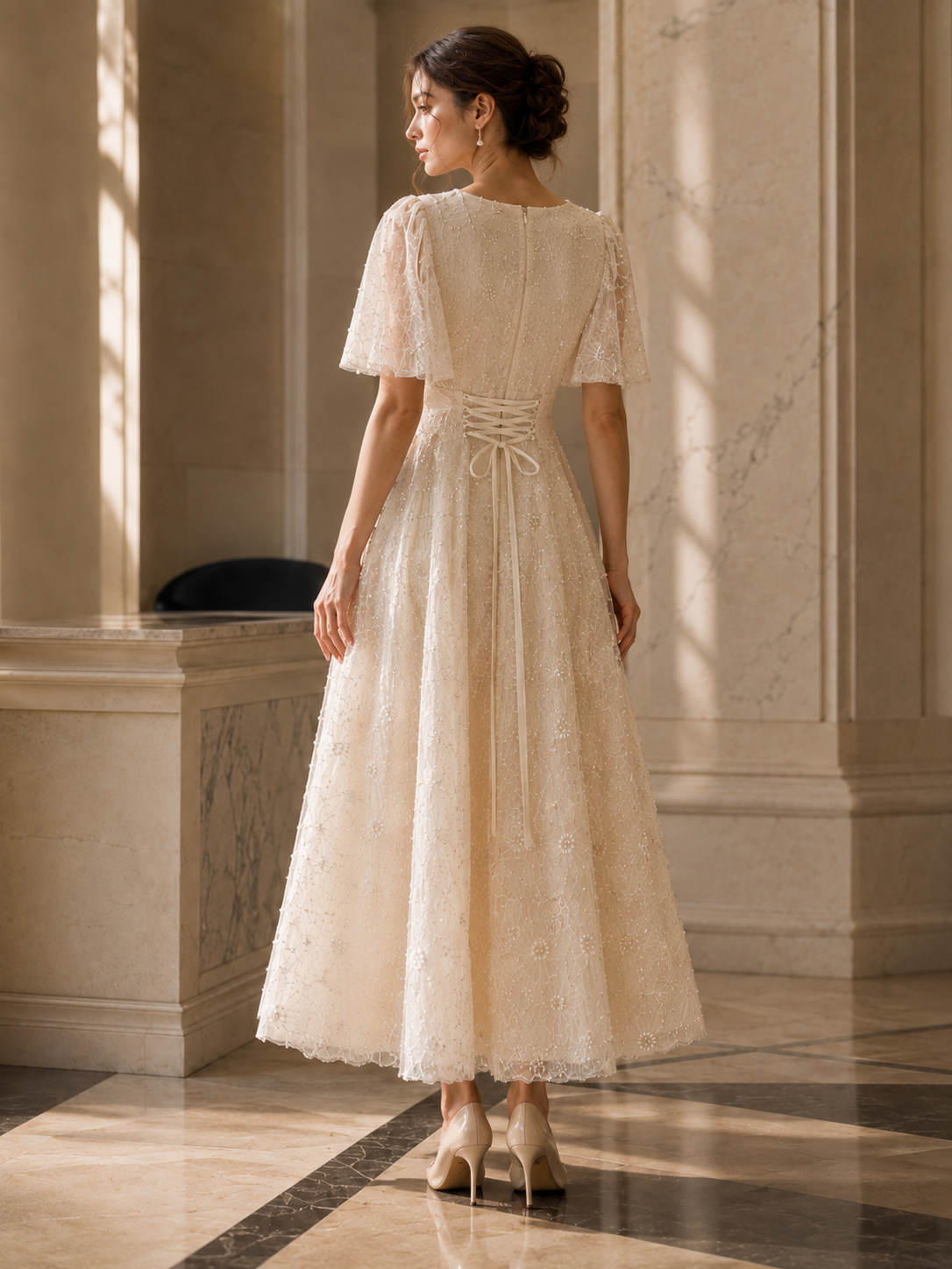 Back view of ivory floral midi dress with center zipper and corset-style lace-up waist detail
